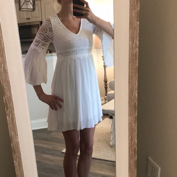 easel Dresses & Skirts - White bell sleeved/crochet dress